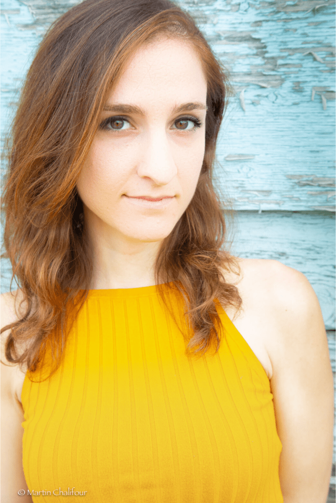 Ariana in a yellow shirt